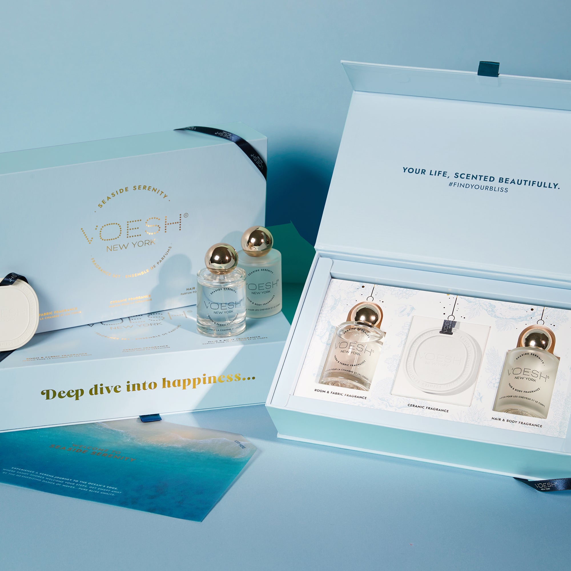Three Seaside Serenity Fragrance Set boxes, one open and two closed, on a blue background.